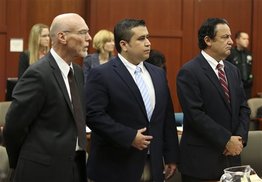 Attorney Don West, left, and jury consultant Robert Hirschhorn, right, stand with George Zimmerman as potential jurors enter the courtroom for Zimmerman's trial in Seminole circuit court in Sanford, Fla., on Thursday.