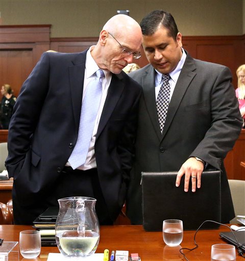 George Zimmerman, right, talks with defense attorney Don West in Seminole Circuit Court in Sanford, Fla., Monday.