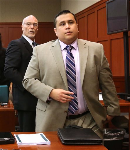 George Zimmerman, right, and attorney Don West, stand as the judge enters the courtroom in Seminole circuit court for a pretrial hearing, in Sanford, Fla., Saturday. Zimmerman has been charged with second-degree murder for the 2012 shooting death of Trayvon Martin.