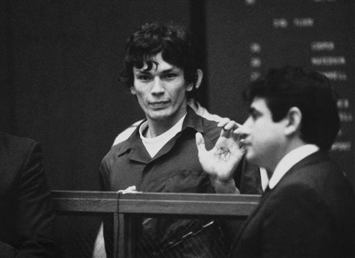 Richard Ramirez, center, know as the Night Stalker, shows a pentagram on the palm of his hand in court in this 1985 file photo. San Quentin State Prison spokesman Lt. Sam Robinson said Ramirez died Friday.
