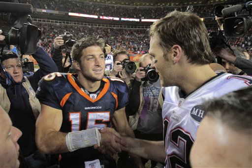 Denver Broncos quarterback Tim Tebow (15) greets New England Patriots quarterback Tom Brady (12) after a game on Sunday, Dec. 18, 2011, in Denver. Tebow will reportedly sign with the Patriots and report to mini-camp on Tuesday.