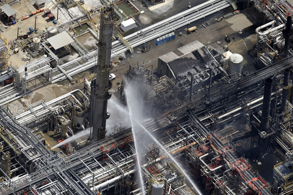 A chemical plant fire is seen in an aerial photo about twenty miles southeast of Baton Rouge, in Geismer, La., Thursday.The plant makes highly flammable gases that are basic building blocks in the petrochemical industry. (AP Photo/Gerald Herbert)