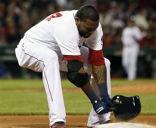 Boston Red Sox's David Ortiz slams his helmet on first base after grounding out in the eighth inning of a baseball game against the Texas Rangers in Boston, Wednesday, June 5, 2013. The Rangers won 3-2. (AP Photo/Michael Dwyer)