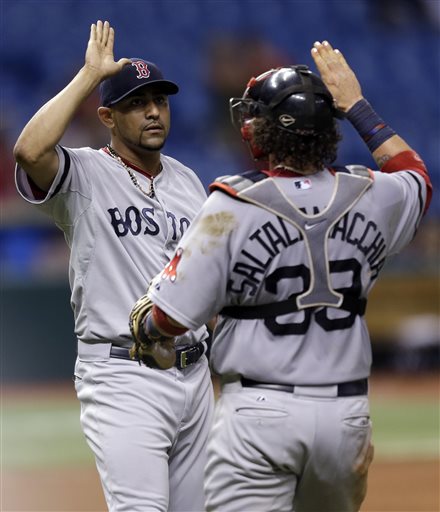 Boston Red Sox relief pitcher Franklin Morales, left, high fives catcher Jarrod Saltalamacchia after the team defeated the Tampa Bay Rays 10-8 in 14 innings during a baseball game Tuesday, June 11, 2013, in St. Petersburg, Fla. (AP Photo/Chris O'Meara) Tropicana Field;Tampa Bay Rays