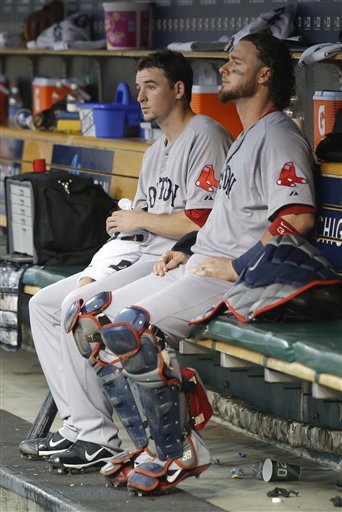 Boston Red Sox pitcher Allen Webster, left, sits in the dugout with catcher Jarrod Saltalamacchia after pitching the first inning and giving up a grand slam to Detroit Tigers catcher Victor Martinez on Saturday in Detroit. The Tigers won 10-3.