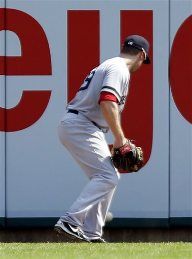 Boston Red Sox right fielder Daniel Nava chases a ball, that he dropped for an error, hit by Detroit Tigers' Avisail Garcia in the eighth inning on Sunday in Detroit. Red Sox manager John Farrell argued the call and was ejected from the game. The Tigers defeated the Red Sox 7-5.