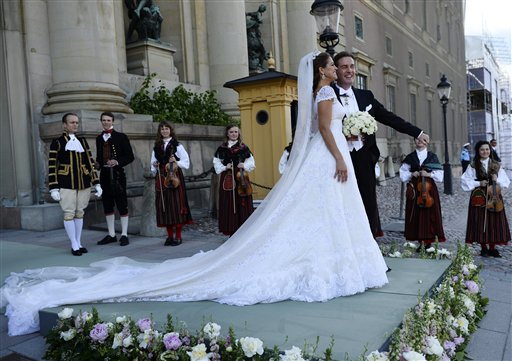 Princess Madeleine and her husband, Christopher O'Neill, stand outside the Royal Chapel after the irwedding ceremony in Stockholm on Saturday.