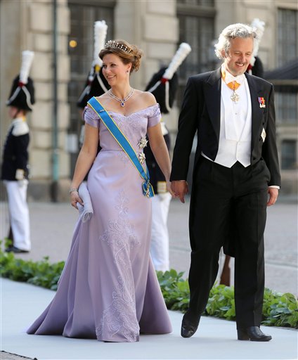 Princess Martha Louise of Norway with her husband, Ari Behn, arrive at the Royal Chapel before the wedding of Sweden's Princess Madeleine and Christopher O'Neill, in Stockholm on Saturday.