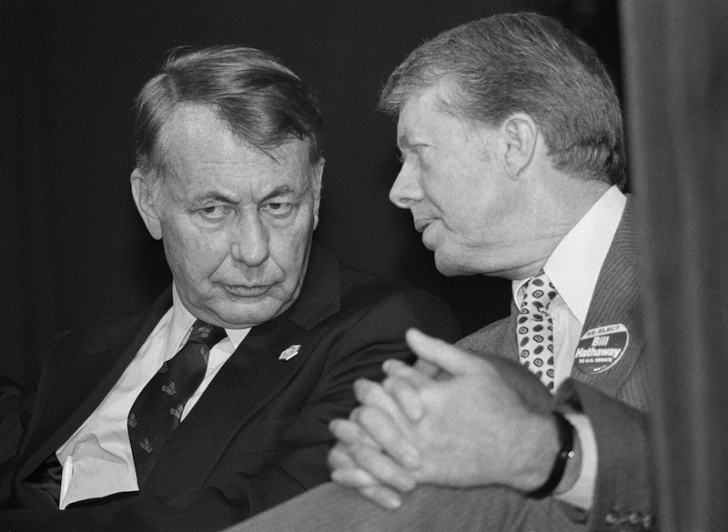 President Jimmy Carter, right, talks with Sen. William D. Hathaway of Maine as Carter wears a Hathaway button at a fundraiser dinner in Portland, Maine, Oct. 29, 1978. (AP Photo/Dennis Cook) Sitting Communication Looking Away Authority