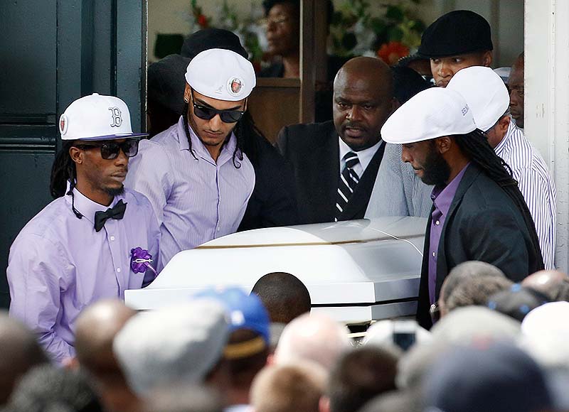 Pallbearers carry the casket of Odin LLoyd following a funeral ceremony at the Church of the Holy Spirit in Boston in Boston on Saturday. Hundreds of relatives, friends and well-wishers wept together and hugged at the funeral for LLoyd, a semi-pro football player whose killing led to murder and weapons charges against former New England Patriots player Aaron Hernandez.