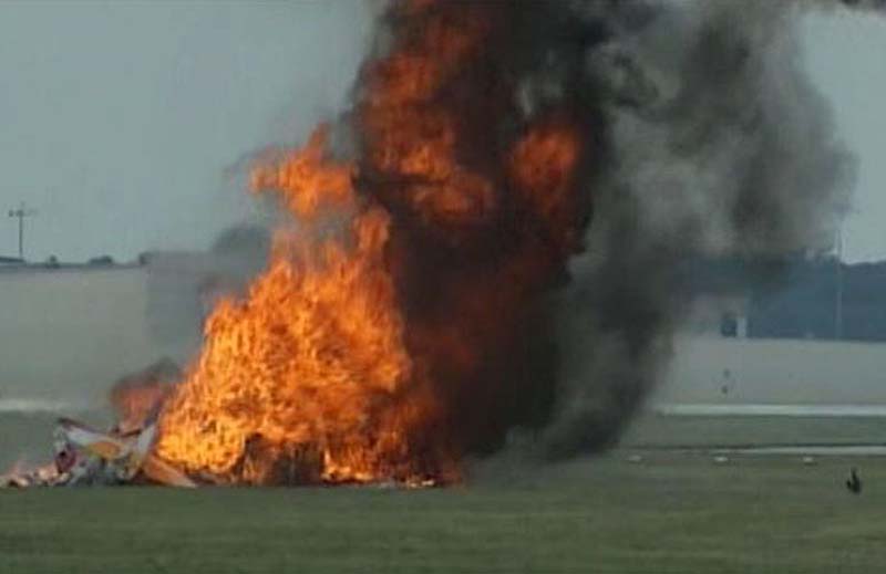 This photo provided provided by WHIO TV shows a plane after it crashed Saturday at the Vectren Air Show near Dayton, Ohio. There was no immediate word on the fate of the pilot, wing walker or anyone else aboard the plane. No one on the ground was hurt.