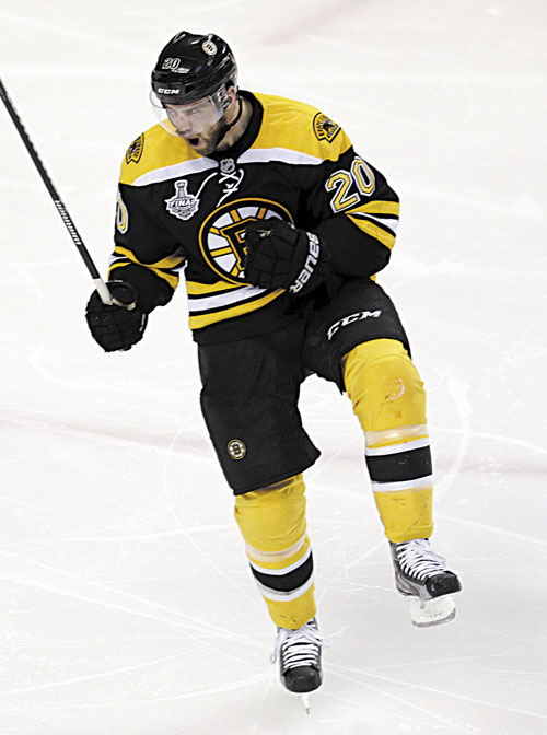 TIME TO CELEBRATE: Boston Bruins left wing Daniel Paille celebrates his goal against the Chicago Blackhawks during the second period in Game 3 of the Stanley Cup finals Monday in Boston.