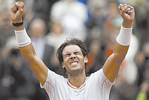 ANOTHER WIN: Rafael Nadal celebrates after defeating David Ferrer in the men’s final at the French Open on Sunday at the Roland Garros stadium in Paris. Nadal won 6-3, 6-2, 6-3.