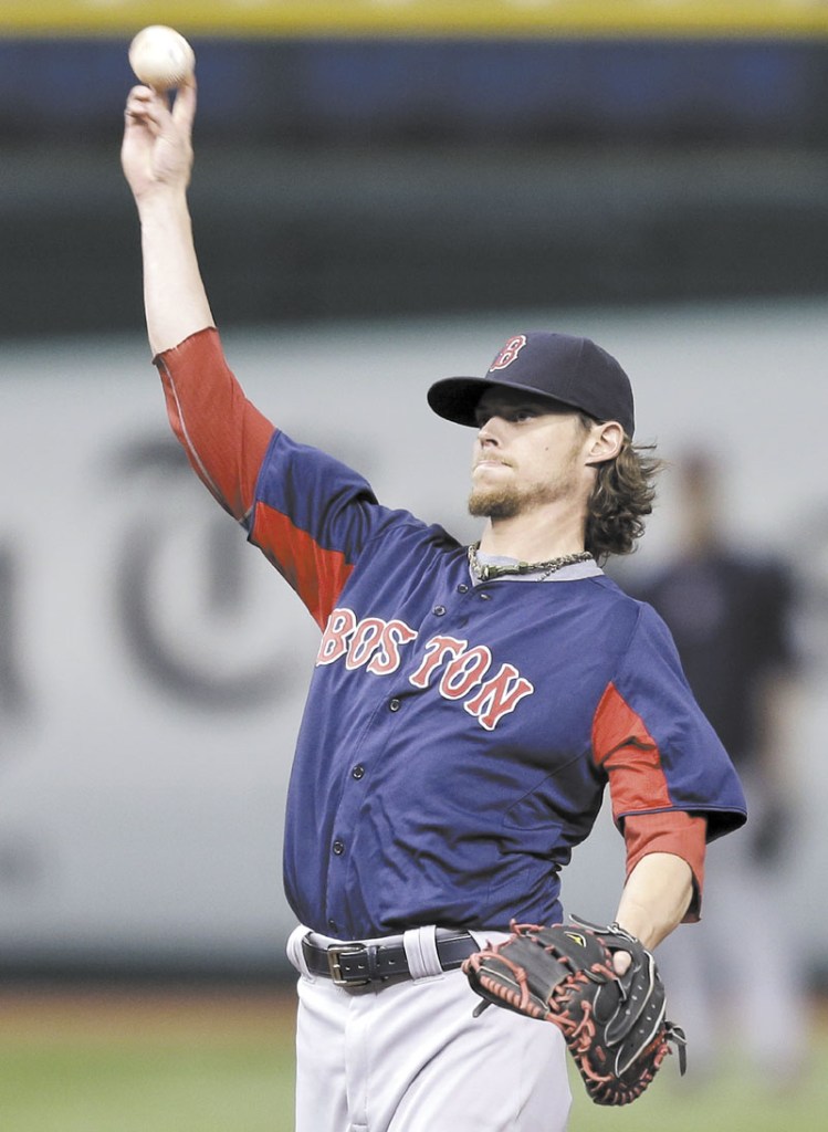 HOPING TO START SOON: Boston Red Sox starting pitcher Clay Buchholz throws the ball to the infield before Wednesday’s game in St. Petersburg, Fla. Buchholz has resumed throwing but a decision hasn’t been made when he will make his next start. Tropicana Field;Tampa Bay Rays