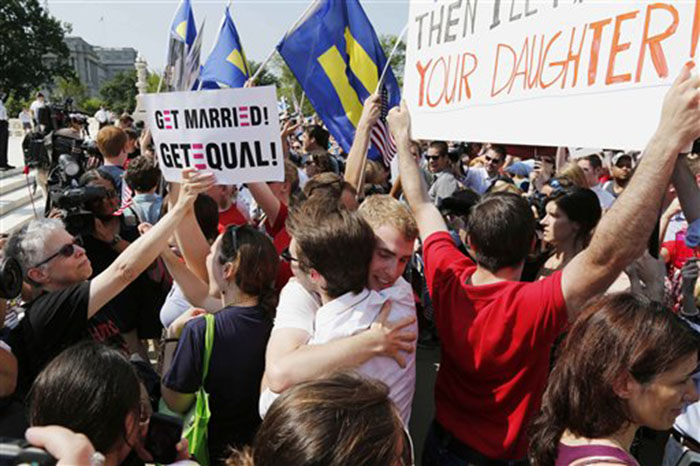 Supporters of gay marriage embrace outside the Supreme Court in Washington on Wednesday after the court cleared the way for same-sex marriage in California by holding that defenders of California's gay marriage ban did not have the right to appeal lower court rulings striking down the ban.