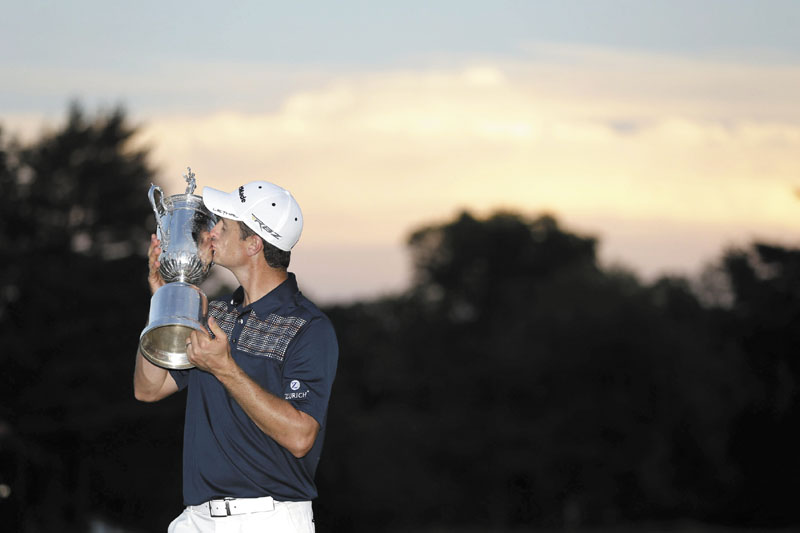 WORTHY OF A KISS: Justin Rose, of England, kisses the trophy after winning the U.S. Open on Sunday at Merion Golf Club, Sunday in Ardmore, Pa.