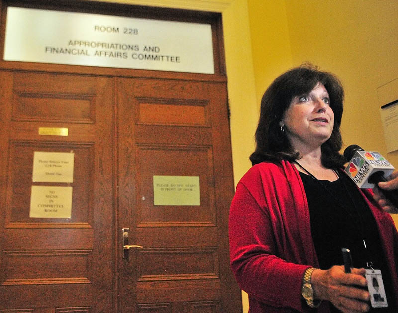 Co-chair Sen. Dawn Hill, D-Cape Neddick, talks to reporters outside the Appropriations Committee room on Friday at the State House in Augusta.