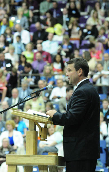 Aaron Moone speaks from the stage during a Jehovah's Witnesses district convention on Friday at the Augusta Civic Center.