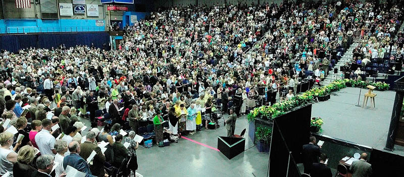 People sing a hymn during a Jehovah's Witnesses district convention on Friday at the Augusta Civic Center.
