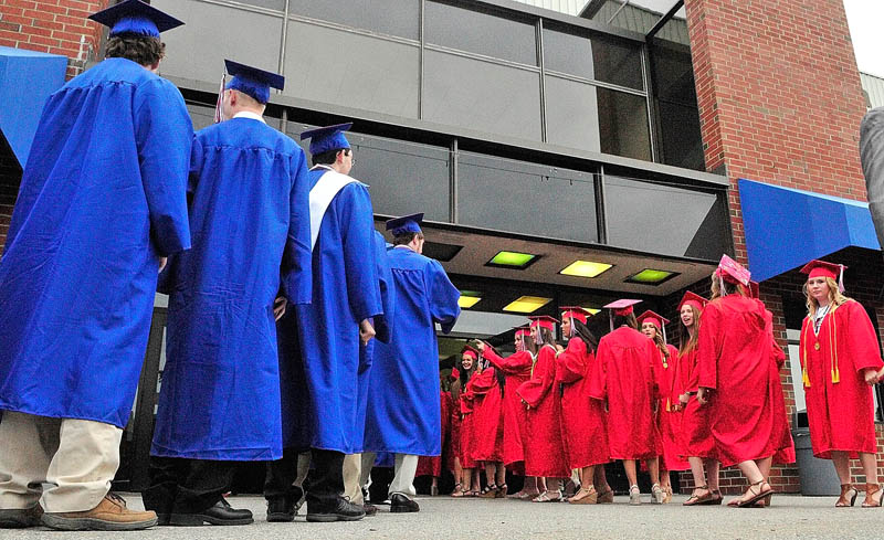 Students march into the building at the start of Messalonskee graduation on Thursday at the Augusta Civic Center.