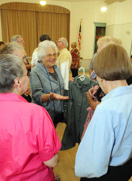 Brenda Boutilier Deojay, center, brought her old Girl Scouts uniform to a reunion of one-room schoolhouse alumni, on Friday at Asa Gile Hall in Readfield.