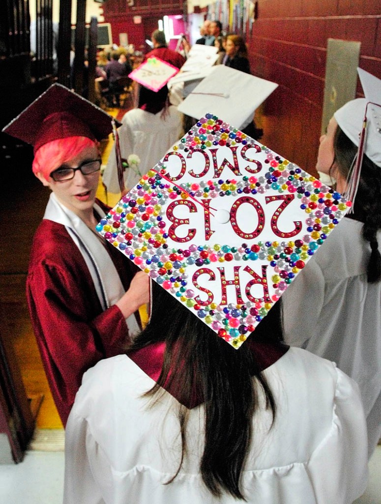 Seniors march into the gym at the start of their commencement ceremony on Saturday at Richmond High School.