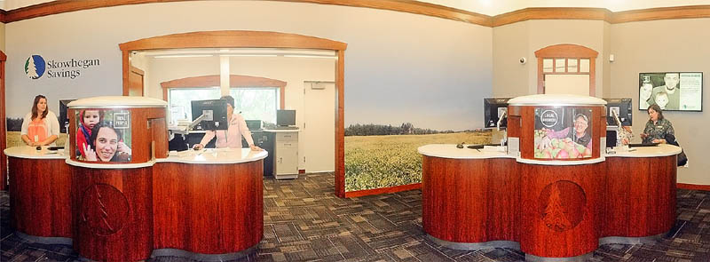 Tellers working behind two pods are seen in the lobby of the new Skowhegan Savings branch on Friday in Augusta.