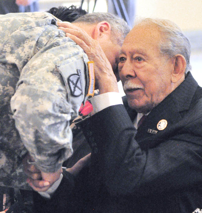 Maine Army National Guard Lt. Col. Jeffery Bilodeau, left, visits with Don Lucero before he was presented with the Bronze Star for bravery, the Purple Heart for suffering injury and the New Mexico Bataan Service Medal.