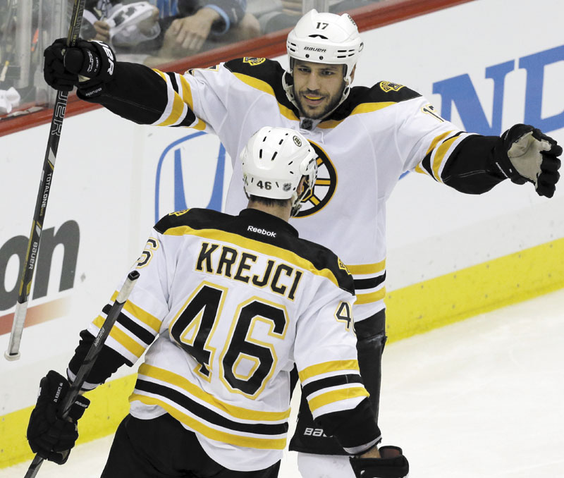 AP photo BIG GAME PLAYER: Boston Bruins’ David Krejci (46) celebrates his second goal of the game with teammate Milan Lucic in the third period of Game 1 of the Eastern Conference finals against the Pittsburgh Penguins. Krejci has nine goals and 21 points to lead the NHL in the postseason.
