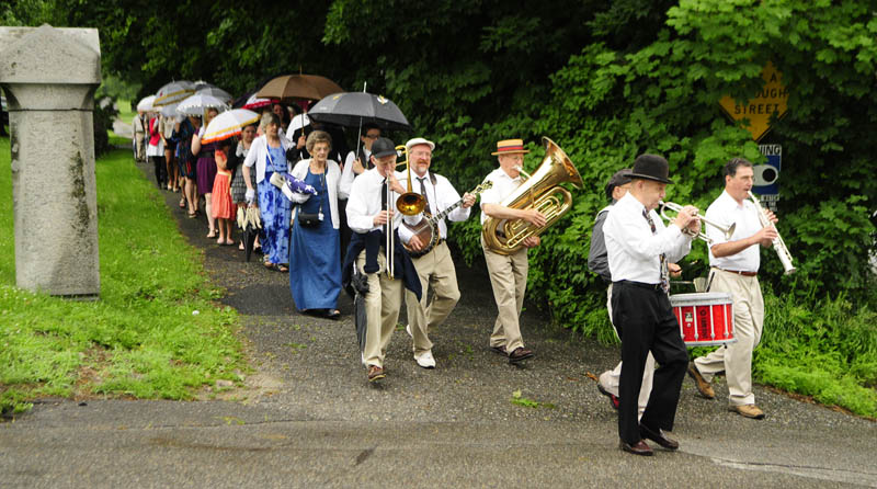 Mel Tukey's Jazz Society Orchestra leads the funeral party out of Forest Grove cemetery, following services for Charles Andrews on Saturday in Augusta.