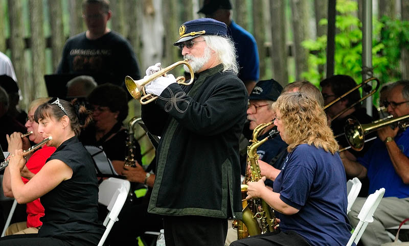 Dennis Harrington plays a cornet that belonged to R.B. Hall during the 33rd R.B. Hall Day Music Festival on Saturday at Old Fort Western in Augusta. Harrington said that the cornet was given by the city of Bangor to musician, bandmaster and composer of marches Robert Browne Hall in 1884. It was on loan, to be played at festival by Reddington Museum in Waterville. There were more than 10 community bands playing at the event.