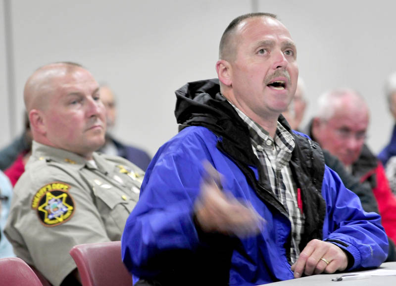 Franklin County Jail administrator Douglas Blauvelt speaks during a public meeting before the state Board of Corrections at the University of Mane in Farmington on Wednesday. At left is Franklin County Sheriff Scott Nichols.