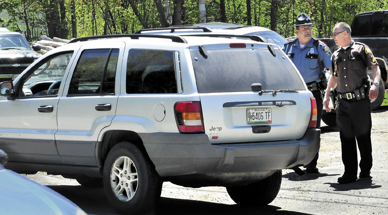 Police from several agencies converged at a residence on the Middle Road in Skowhegan, Wednesday, May 15, after Ernest Almeida, of Waterville, abandoned his vehicle, foreground, following a high speed police chase.