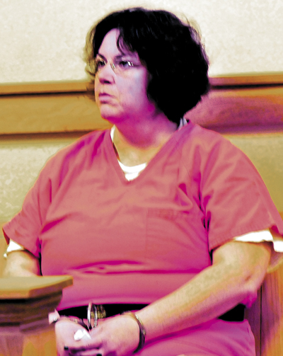 Michele Corson waits for an extradtion hearing in Skowhegan District Court in April.