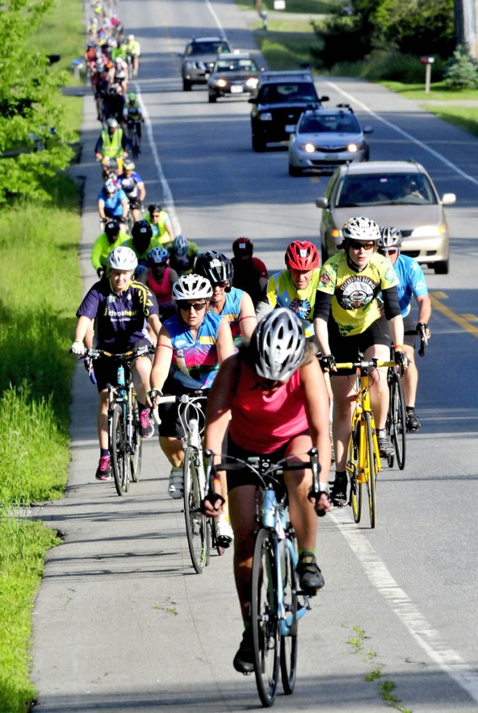 Bicyclists participating in the American Lung Association's 29th annual Trek Across Maine fundraiser ride along Route 137 in Winslow on Sunday.