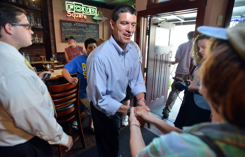 Gabriel Gomez, Republican candidate for U.S. Senate in the Massachusetts open seat special election, greets supporters, Monday, June 24, 2013, at the Four Square restaurant in Braintree, Mass. Gomez faces Democrat Rep. Ed Markey in Tuesday's election. (AP Photo/Josh Reynolds)