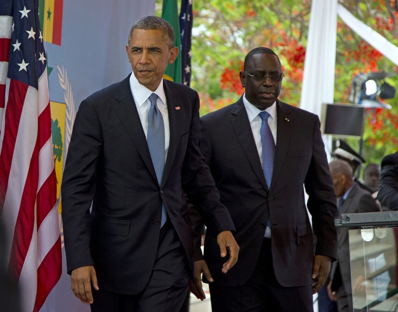 President Obama and Senegalese President Macky Sall leave after a news conference in Dakar, Senegal, on Thursday. Obama is visiting Senegal, South Africa and Tanzania.