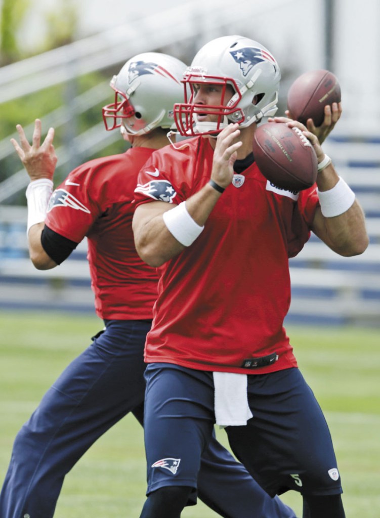 TRYING TO IMPRESS: Quarterback Tim Tebow drops back to throw a pass during New England Patriots mini-camp Wednesday in Foxborough, Mass.