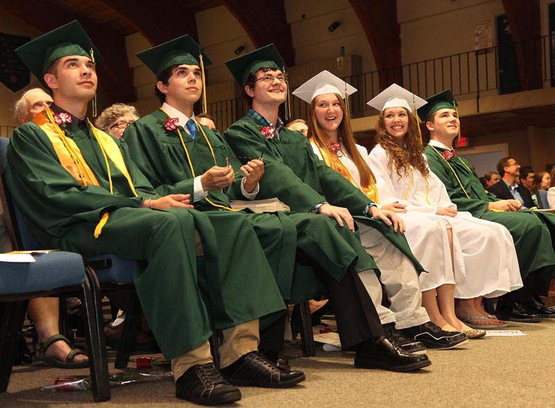The six members of Temple Academy's Class of 2013 react to the senior DVD during commencement in Waterville on Sunday night. From left to right are Adam LaVerdiere, Timothy Dibden, Corey Achramowicz, Sara Bell, Rachael Desrosiers and Isaac Manley. LaVerdiere gave the valedictory address and Dean of Guidance Elise Rossignol gave the commencement address.