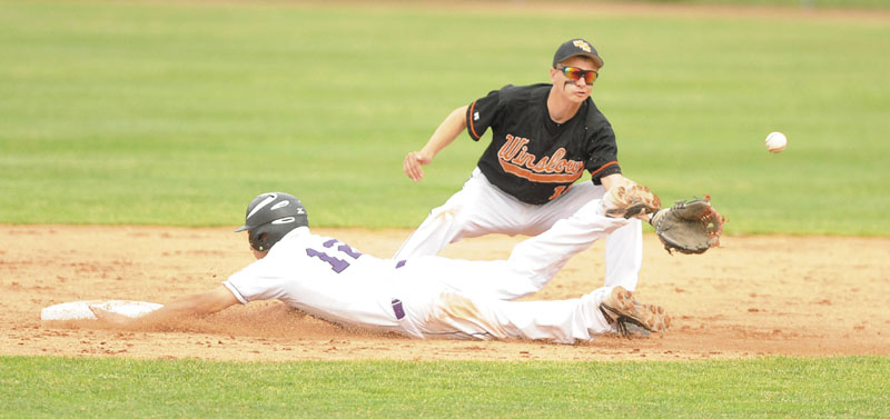 Waterville Senior High School's Tyler Bouchard, 12, slides into second base before the ball can get to Winslow High School second baseman Taylor Roy, 11, in the seventh inning at Mansfield Stadium in Bangor on Thursday. Winslow faces York for the Class B state title Saturday.