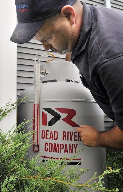Mike Aboud, a service technician for Dead River Company, tests a propane system for leaks at a home in Scarborough on Friday, June 28, 2013.