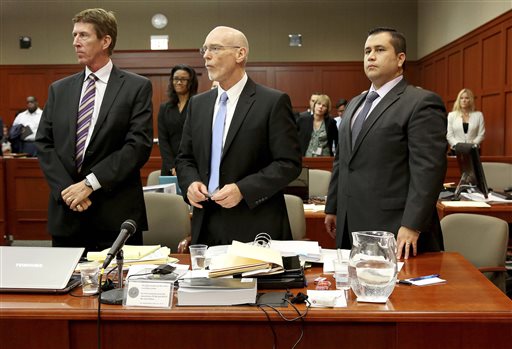 Defense attorneys Mark O'Mara, left, Don West, center, stand with George Zimmerman during Zimmerman's trial in Seminole circuit court, in Sanford, Fla., Wednesday, July 3, 2013. Zimmerman is charged with second-degree murder in the 2012 fatal shooting of slain teen Trayvon Martin.
