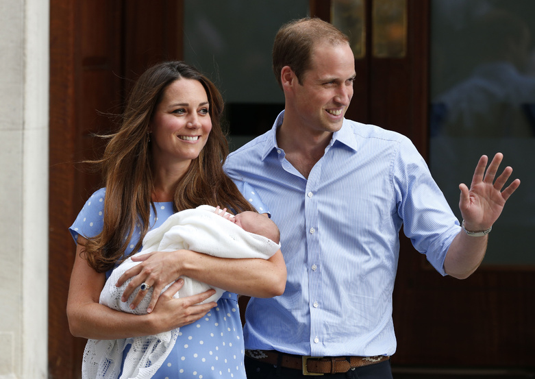Britain's Prince William and Kate, Duchess of Cambridge, hold the newborn Prince of Cambridge on Tuesday as they pose for photographers outside St. Mary's Hospital in London where the Duchess gave birth Monday.