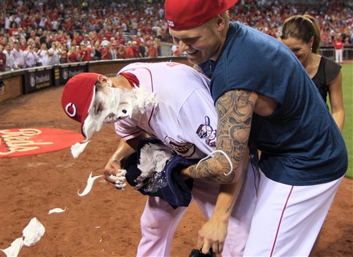 Cincinnati Reds starting pitcher Homer Bailey, left, gets a face full of shaving cream from Mat Latos after Bailey threw a no-hitter against the San Francisco Giants in a baseball game, Tuesday, July 2, 2013, in Cincinnati. Cincinnati won 3-0. (AP Photo/Al Behrman)