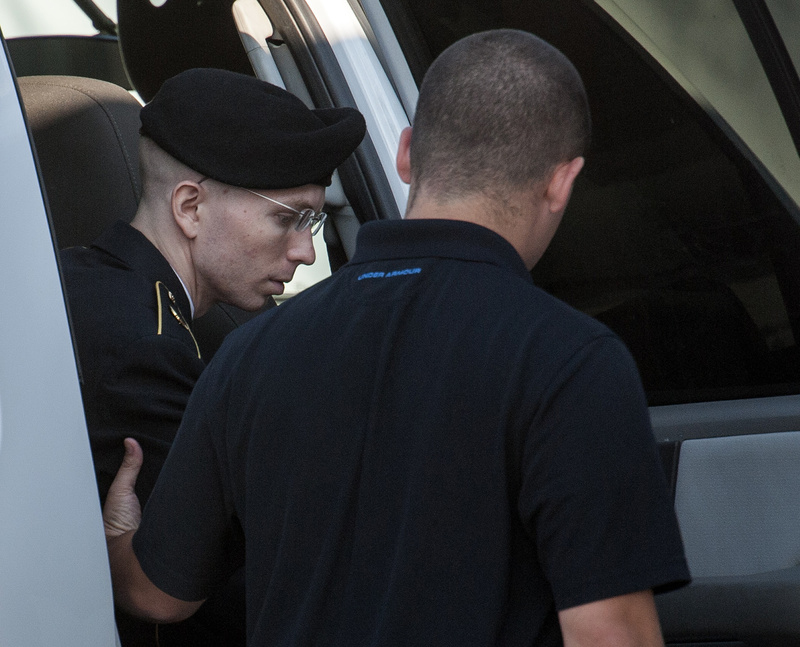 Army Pfc. Bradley Manning is helped out of a security vehicle as he arrives at a courthouse at Fort Meade, Md., on Friday. Manning is charged with indirectly aiding the enemy by sending troves of classified material to WikiLeaks.