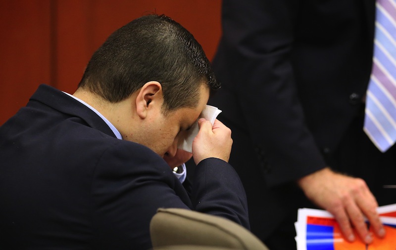George Zimmerman wipes his face after arriving in the courtroom for his trial at the Seminole County Criminal Justice Center, in Sanford, Fla., Friday, July 12, 2013. Zimmerman is charged in the 2012 shooting death of unarmed teenager Trayvon Martin. (AP Photo/Orlando Sentinel, Joe Burbank, Pool)