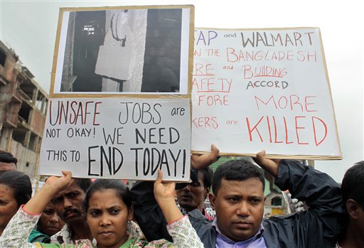 Bangladeshi garment workers, relatives and activists participate in a protest demanding that companies sign the Accord on Fire and Building Safety in Savar, Bangladesh, on June 29, 2013.