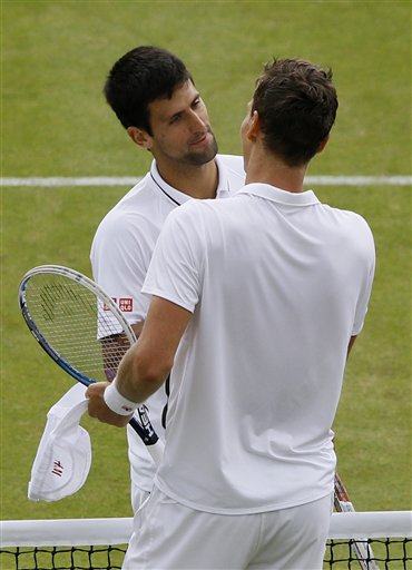 Novak Djokovic greets Tomas Berdych after beating him in a Men's singles quarterfinal match on Wednesday at the All England Lawn Tennis Championships in Wimbledon, London.