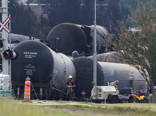 Cleanup continues at the scene of the Lac-Megantic, Quebec, runaway oil train derailment and explosion on Tuesday. Investigators looking for the cause of the fiery oil train derailment are zeroing in on whether an earlier blaze on the same train may have set off a chain of events that led to the explosions that killed at least 13 people.