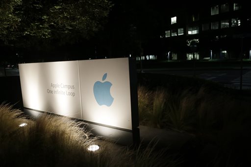 A sign displays the Apple logo outside of the company's headquarters in Cupertino, Calif. A federal judge has ruled that Apple Inc. broke antitrust laws and conspired with publishers to raise electronic book prices, citing "compelling evidence" from the words of the late Steve Jobs.